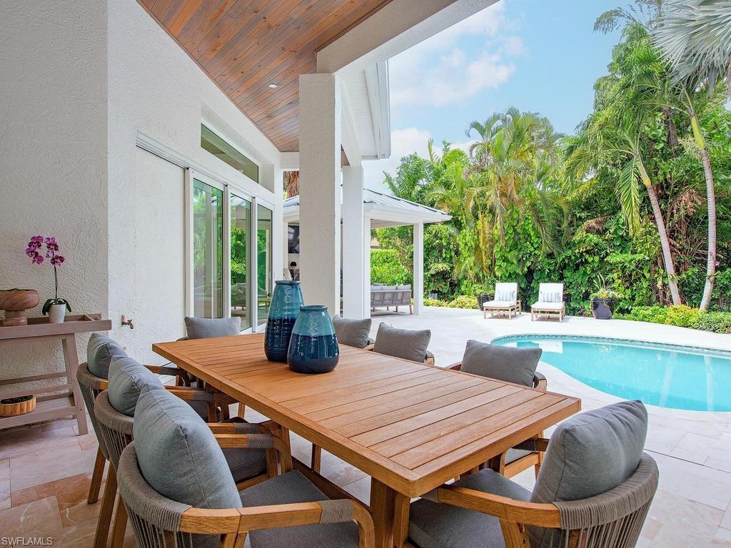 2363 Crayton Road Naples, FL 34103 - Photo 8 of 30 Covered patio featuring a wood-finish ceiling