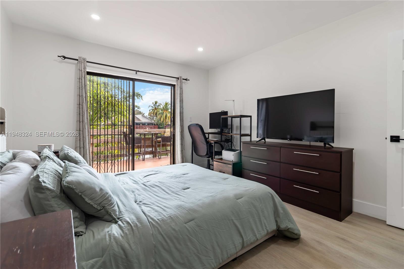 12241 Southwest 24th Terrace, Unit 39 Miami, FL 33175 - Photo 14 of 25 Master Bedroom with Sliding door leading to the deck with Lakeview