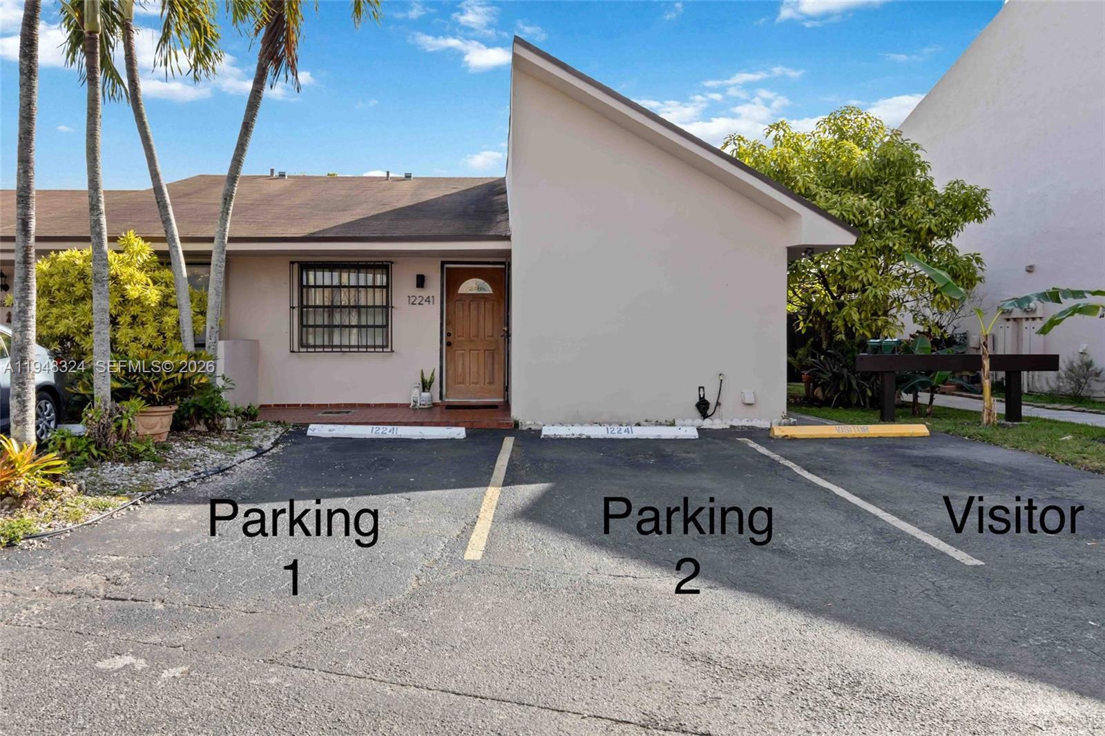 12241 Southwest 24th Terrace, Unit 39 Miami, FL 33175 - Photo 3 of 25 Two deeded parking spaces in front of the home