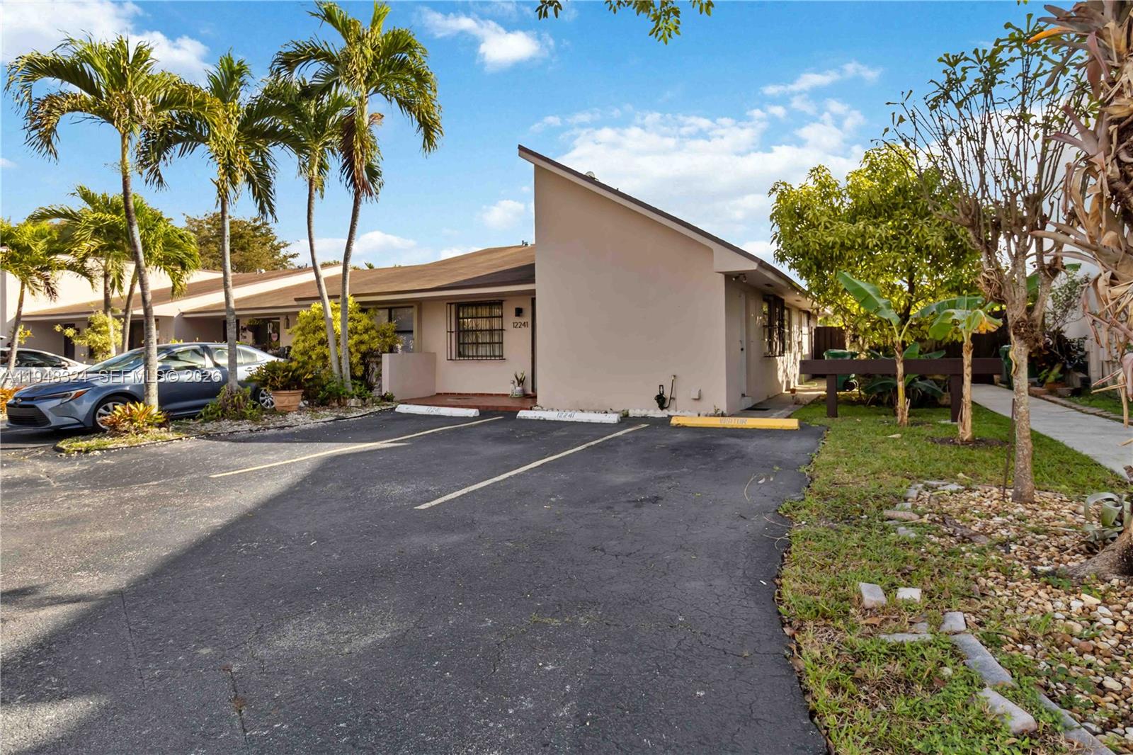 12241 Southwest 24th Terrace, Unit 39 Miami, FL 33175 - Photo 6 of 25 2nd entrance on the right side of the property leading into the kitchen