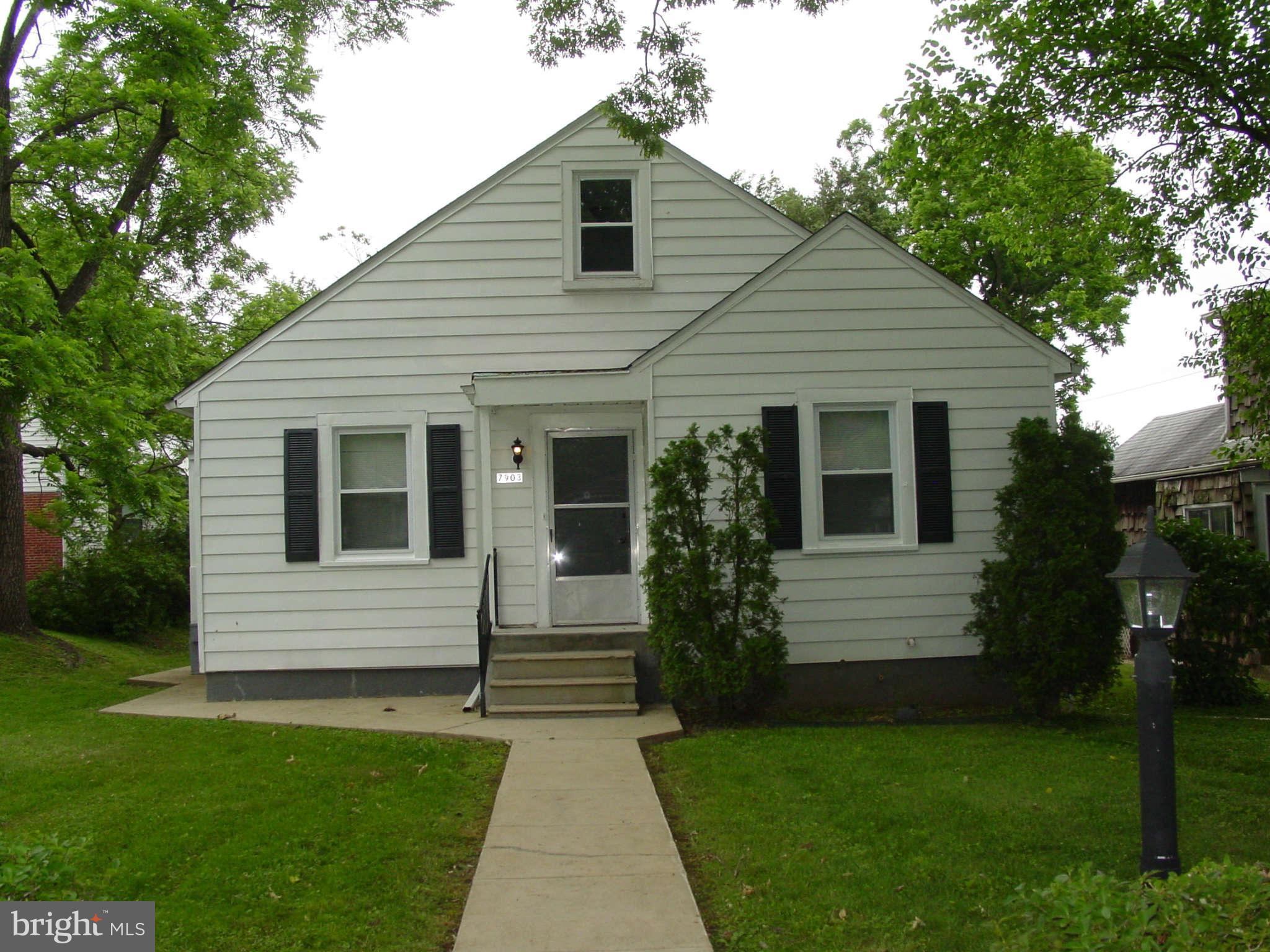 7903 Bon Air Road Baltimore, MD 21234 - Photo 1 of 17 a front view of house with yard and green space