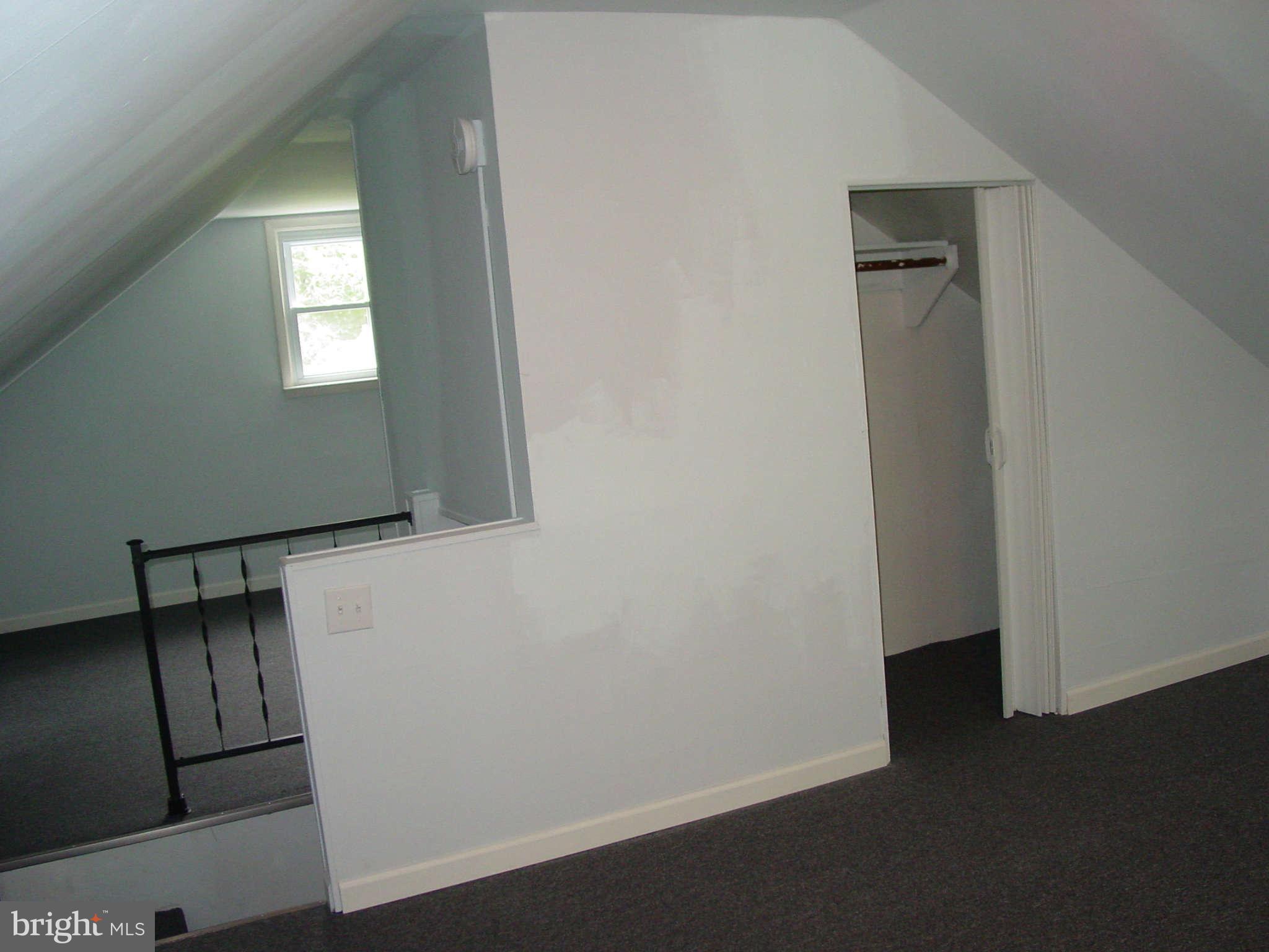 7903 Bon Air Road Baltimore, MD 21234 - Photo 11 of 17 an empty room with wooden floor and windows