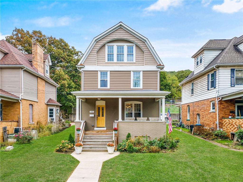a front view of a house with a yard