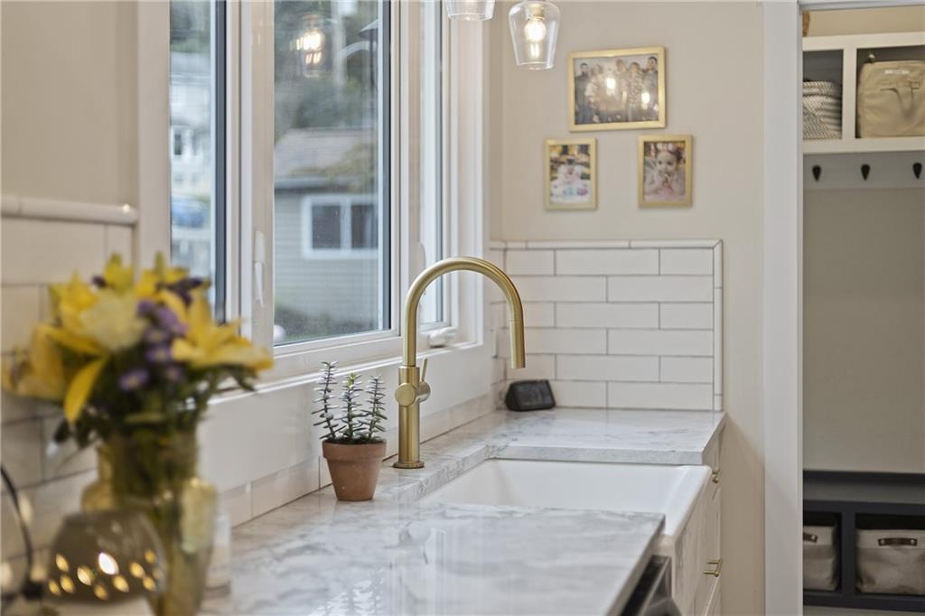 103 Main Street Ambridge, PA 15003 - Photo 16 of 49 a bathroom with a sink and a mirror