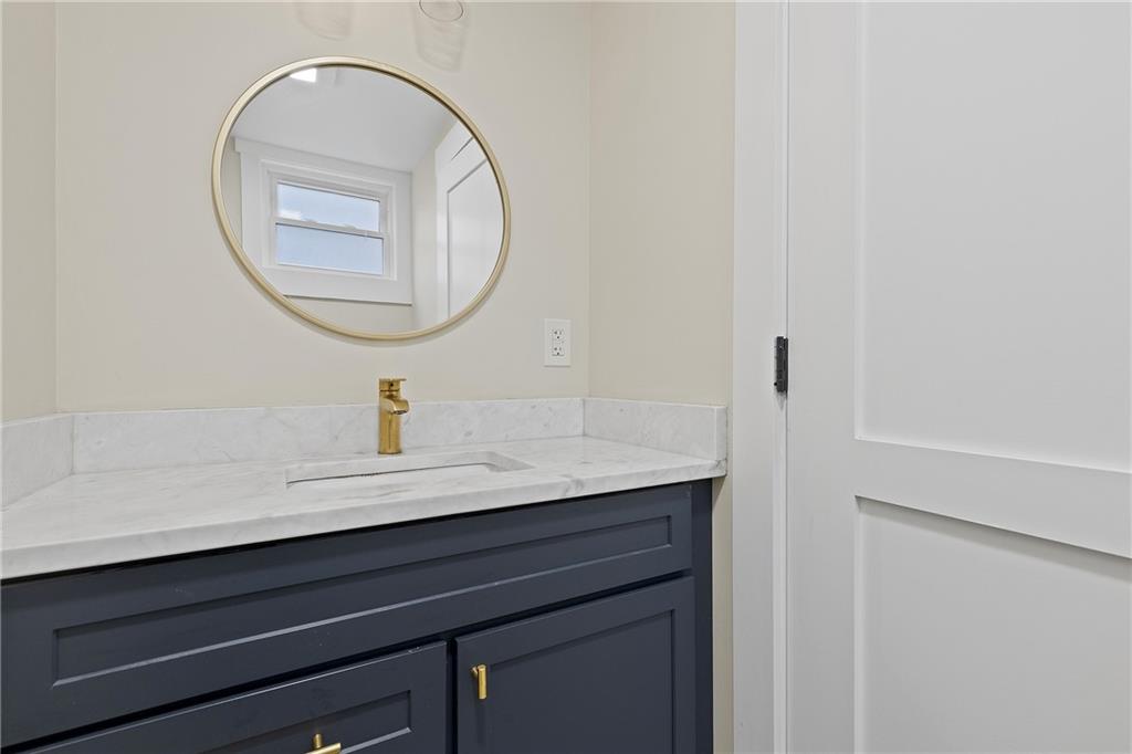 103 Main Street Ambridge, PA 15003 - Photo 20 of 49 a bathroom with a sink and a mirror