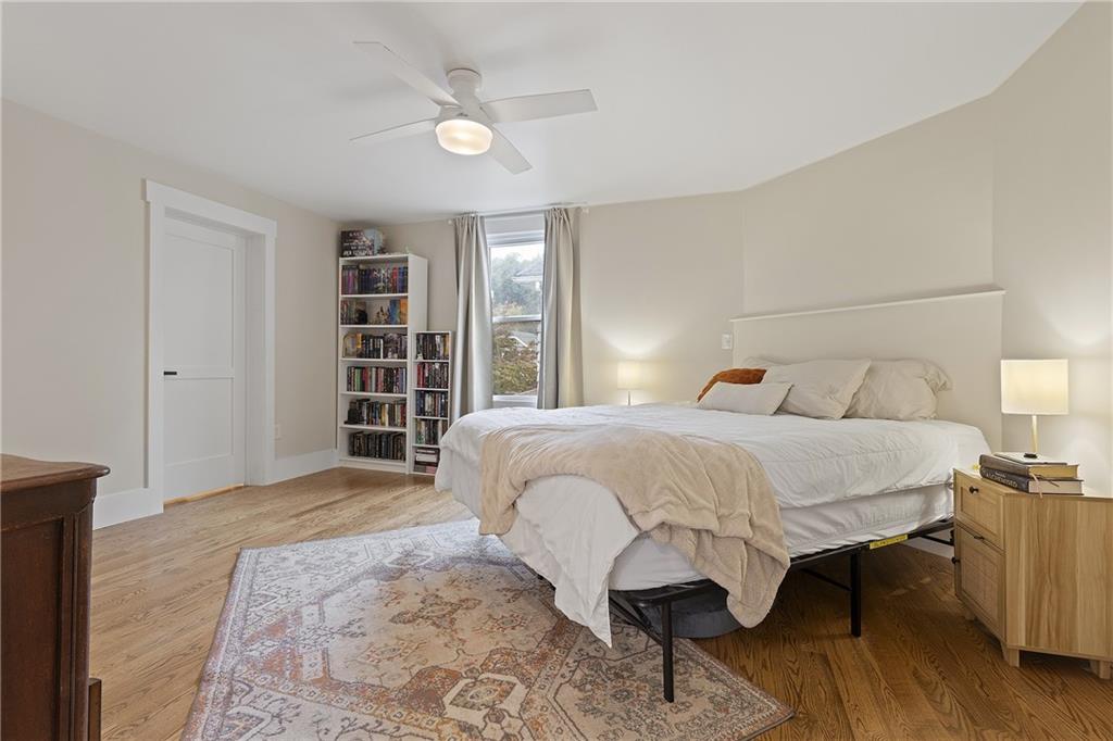 103 Main Street Ambridge, PA 15003 - Photo 21 of 49 a bedroom with a large bed and a chandelier