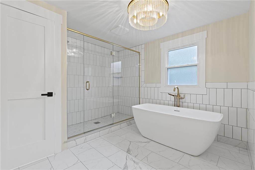 103 Main Street Ambridge, PA 15003 - Photo 25 of 49 a spacious bathroom with a bathtub and shower