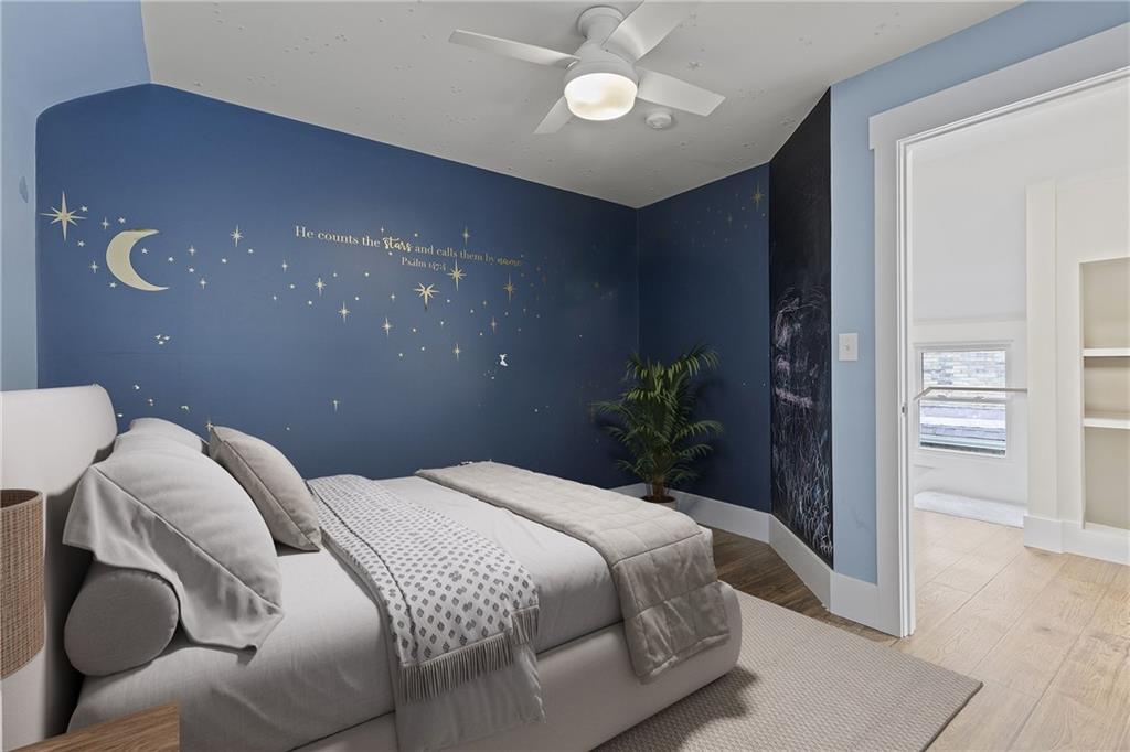 103 Main Street Ambridge, PA 15003 - Photo 32 of 49 a bedroom with a bed and chandelier