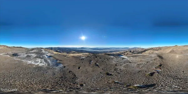a view of mountains and valleys