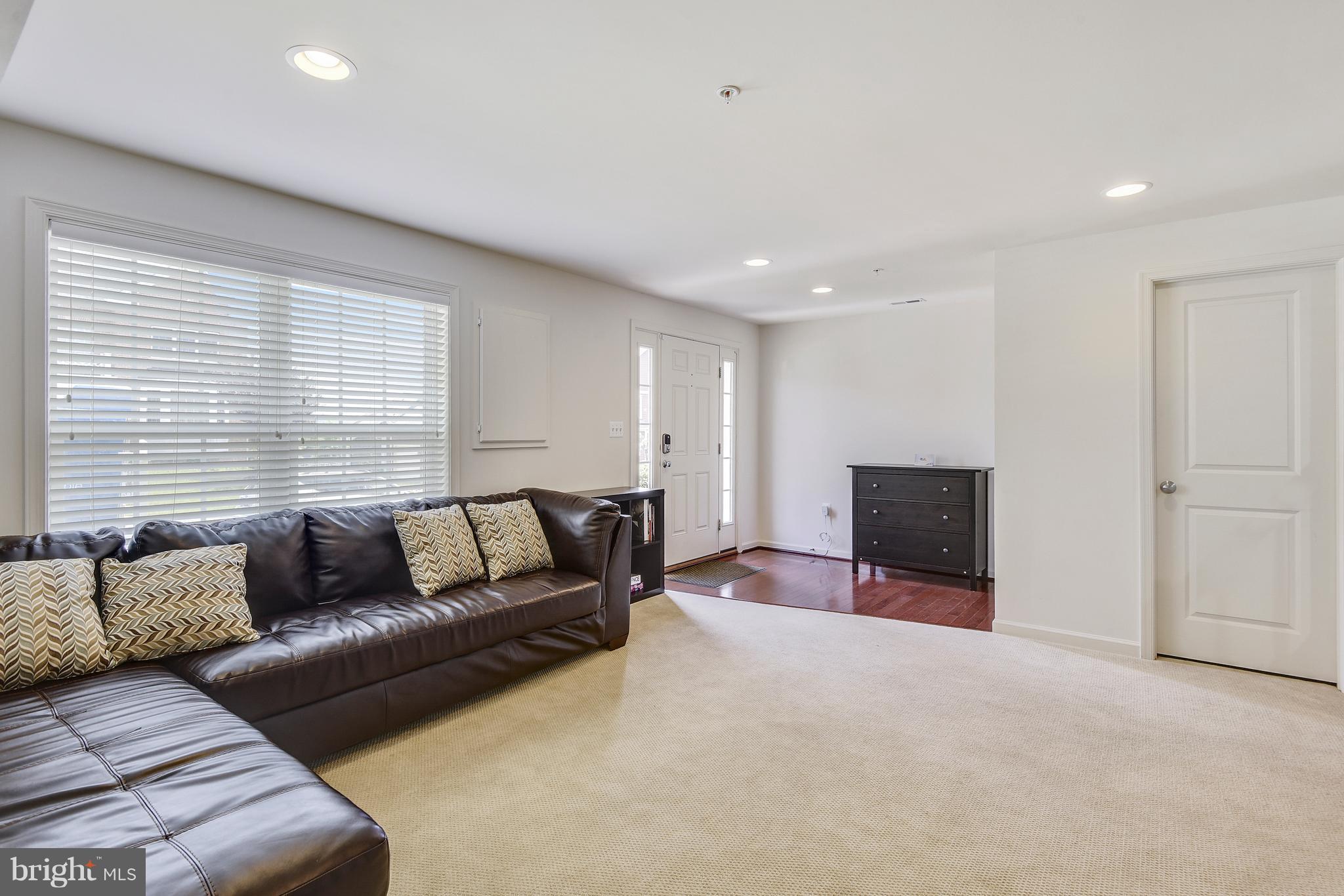 13612 Stargazer Lane Silver Spring, MD 20906 - Photo 3 of 30 a living room with furniture and a fireplace