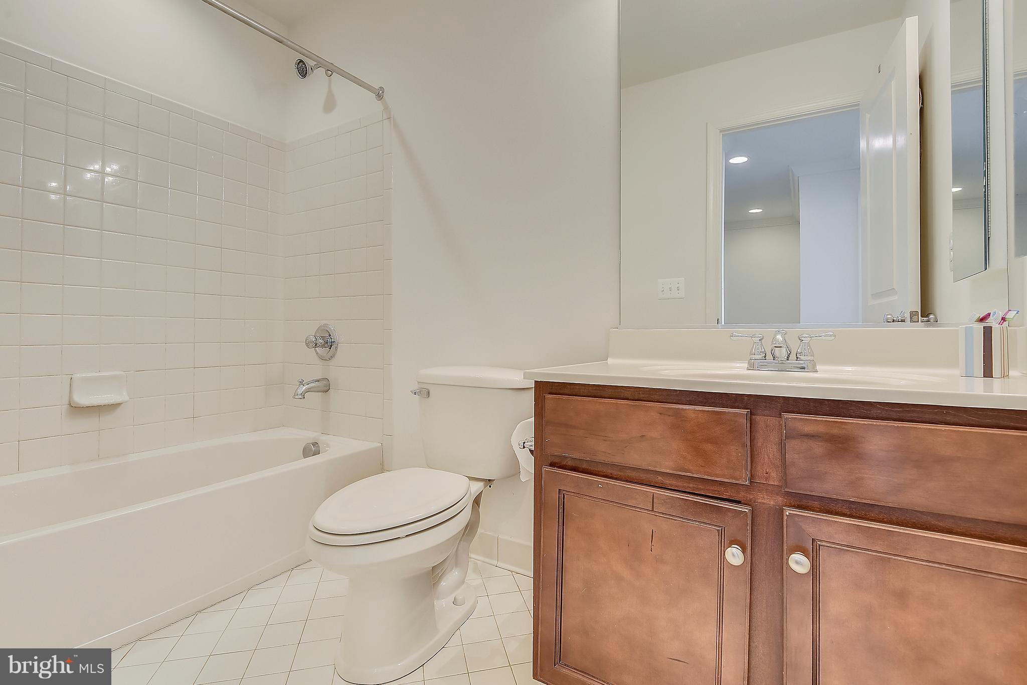 13612 Stargazer Lane Silver Spring, MD 20906 - Photo 22 of 30 a bathroom with a sink a toilet and a bathtub