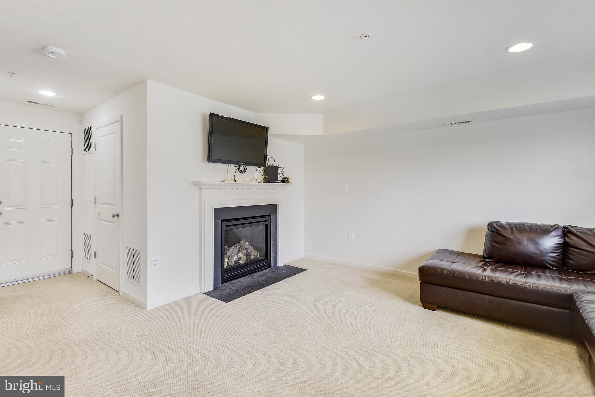 13612 Stargazer Lane Silver Spring, MD 20906 - Photo 5 of 30 a living room with furniture and a fireplace