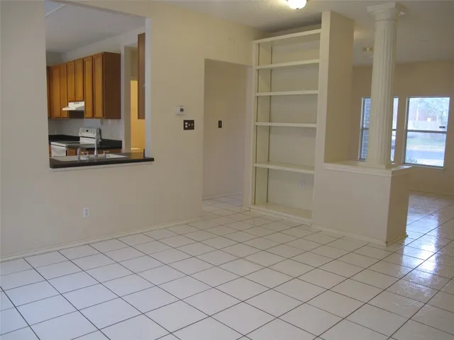 a kitchen with a stove and a cabinets