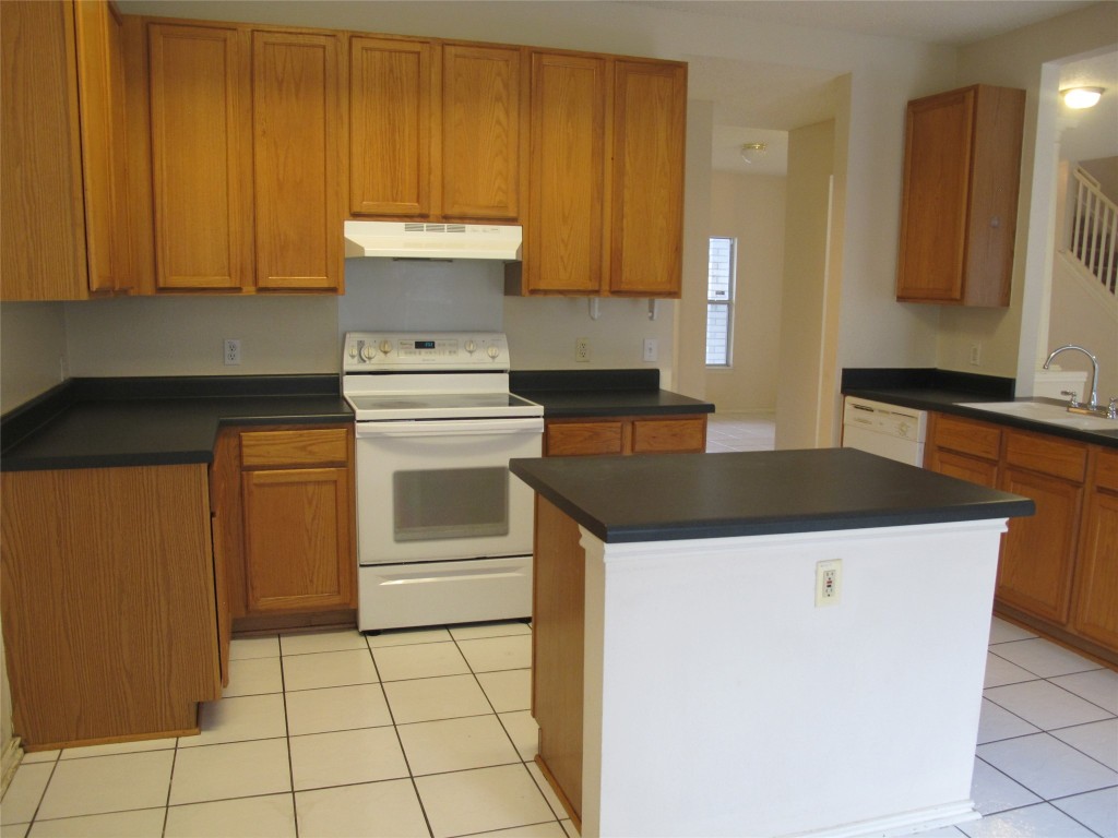 2011 Jasper Lane Cedar Park, TX 78613 - Photo 16 of 40 a kitchen with a stove and a cabinets
