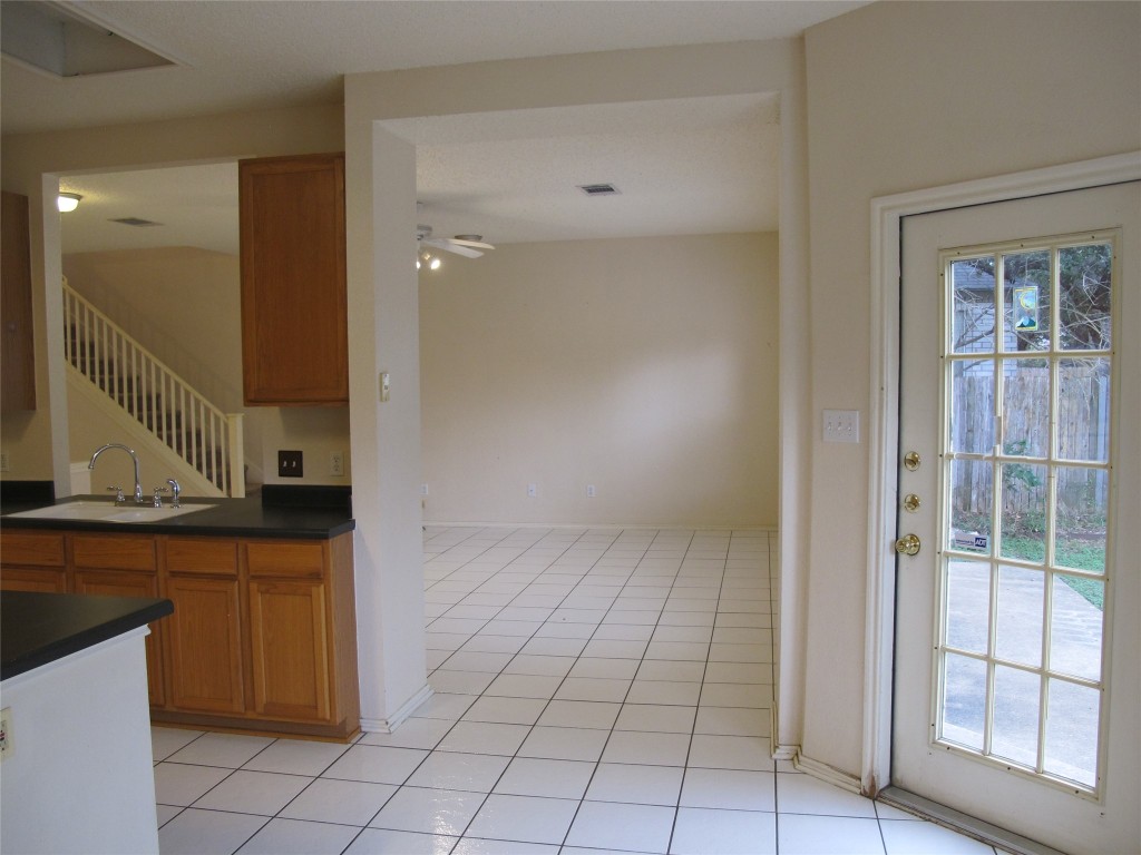 2011 Jasper Lane Cedar Park, TX 78613 - Photo 18 of 40 a view of a kitchen from the hallway with windows