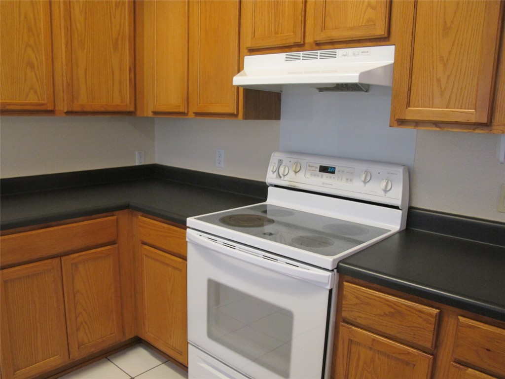 2011 Jasper Lane Cedar Park, TX 78613 - Photo 20 of 40 a kitchen with a stove and a microwave