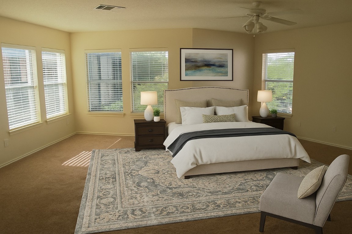 2011 Jasper Lane Cedar Park, TX 78613 - Photo 23 of 40 a bedroom with a bed lamp and a large window