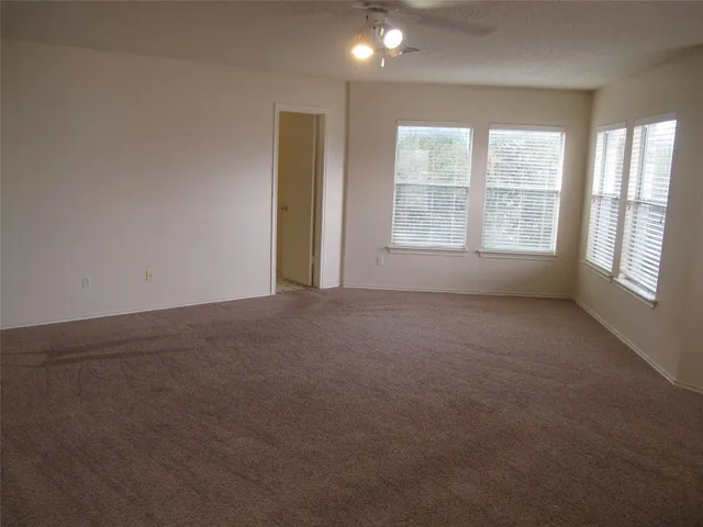 a view of an empty room and window