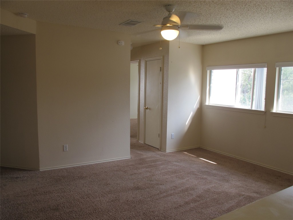 2011 Jasper Lane Cedar Park, TX 78613 - Photo 26 of 40 an empty room with windows and fan