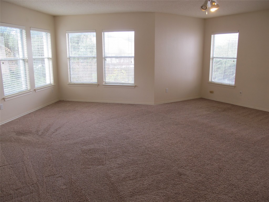 2011 Jasper Lane Cedar Park, TX 78613 - Photo 27 of 40 an empty room with windows