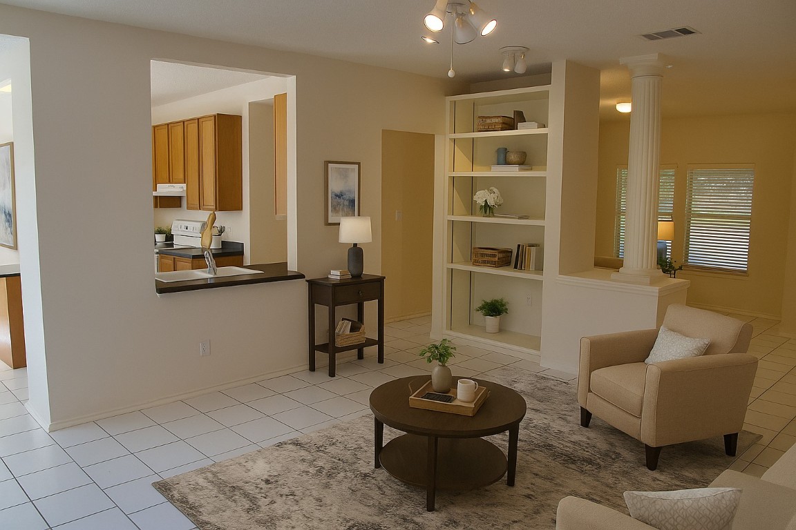 2011 Jasper Lane Cedar Park, TX 78613 - Photo 6 of 40 a living room with furniture and a potted plant