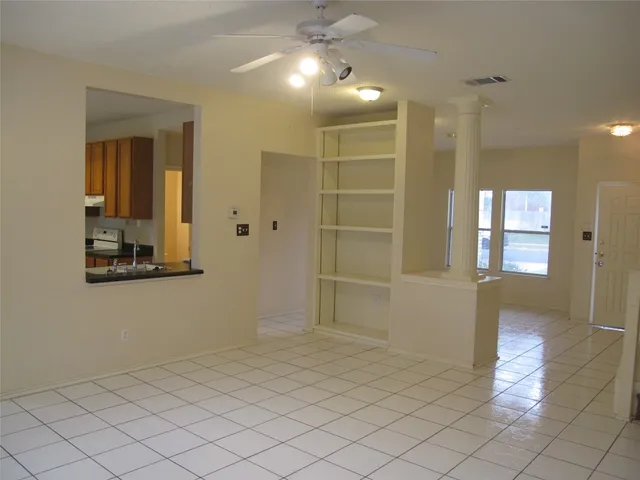 a view of a dining room with furniture and window