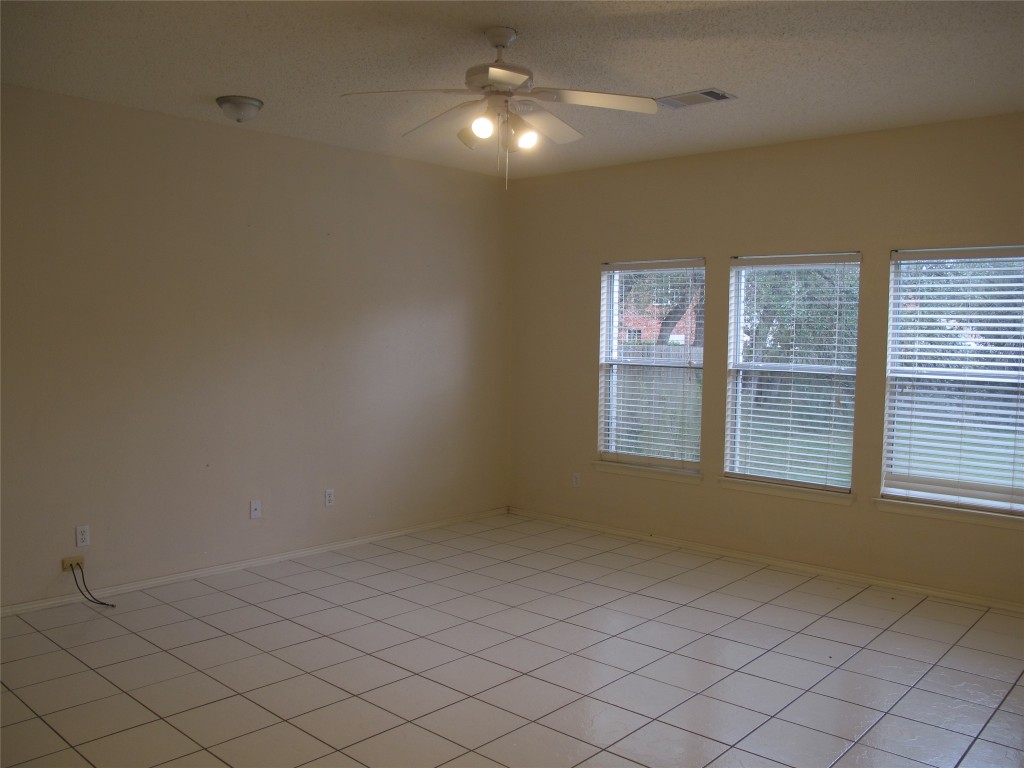 2011 Jasper Lane Cedar Park, TX 78613 - Photo 10 of 40 a view of an empty room with windows