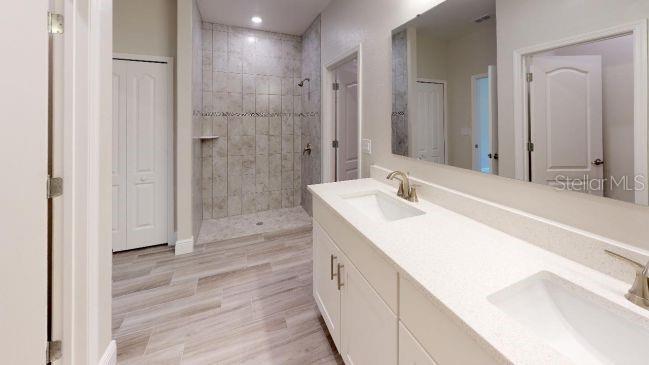 Tbd Mohawk Road Venice, FL 34293 - Photo 10 of 16 a spacious bathroom with a tub sink and shower