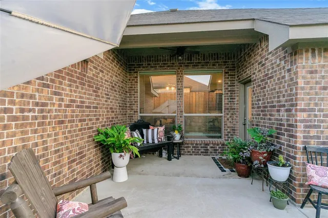 a couple of potted plants in front of door