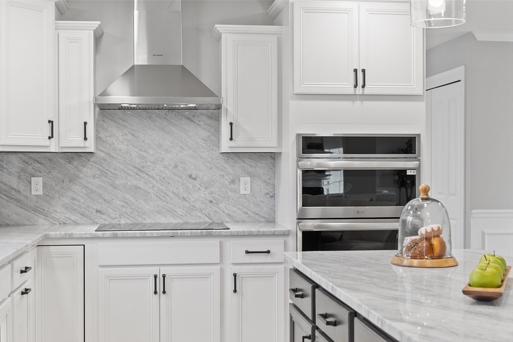 2 Davis Road Westminster, MA 01473 - Photo 22 of 41 a kitchen with a stove and a white wooden cabinets