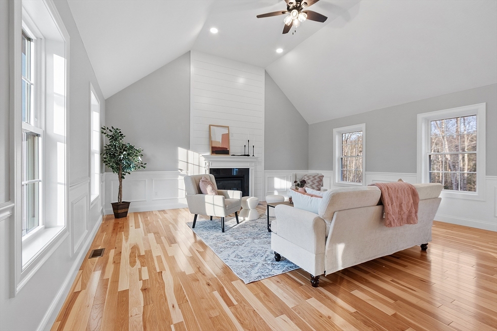 2 Davis Road Westminster, MA 01473 - Photo 3 of 41 a living room with furniture a fireplace and a chandelier
