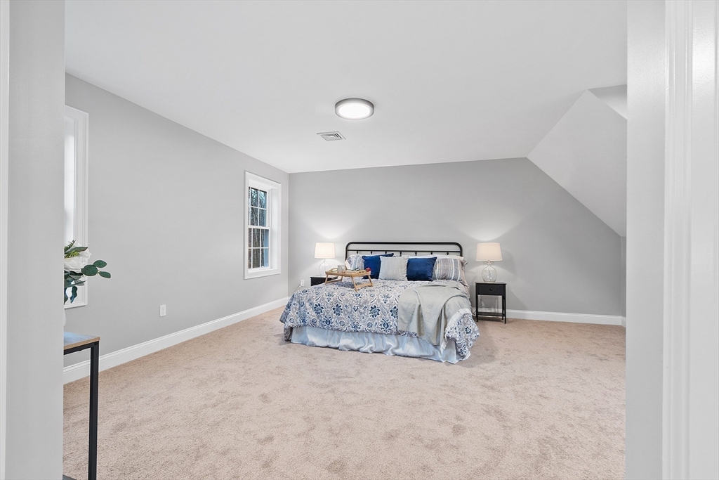 2 Davis Road Westminster, MA 01473 - Photo 35 of 41 a bedroom with a bed and a potted plant