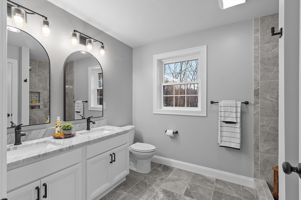 2 Davis Road Westminster, MA 01473 - Photo 37 of 41 a spacious bathroom with a double vanity sink a mirror and a shower