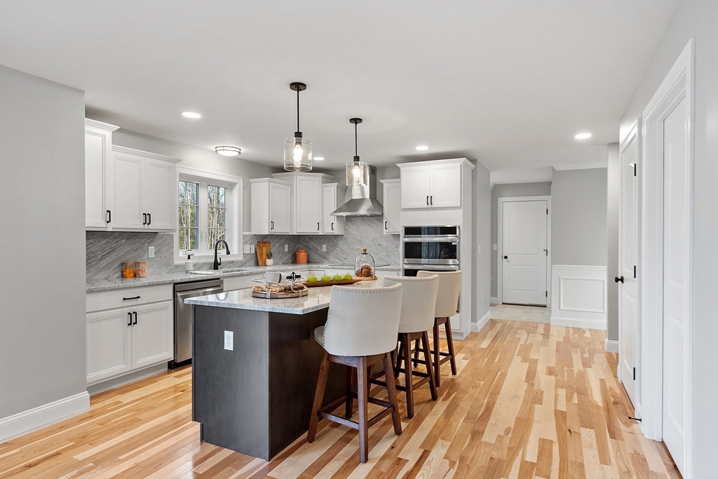 2 Davis Road Westminster, MA 01473 - Photo 5 of 41 a kitchen with kitchen island granite countertop a sink a counter space stainless steel appliances and cabinets