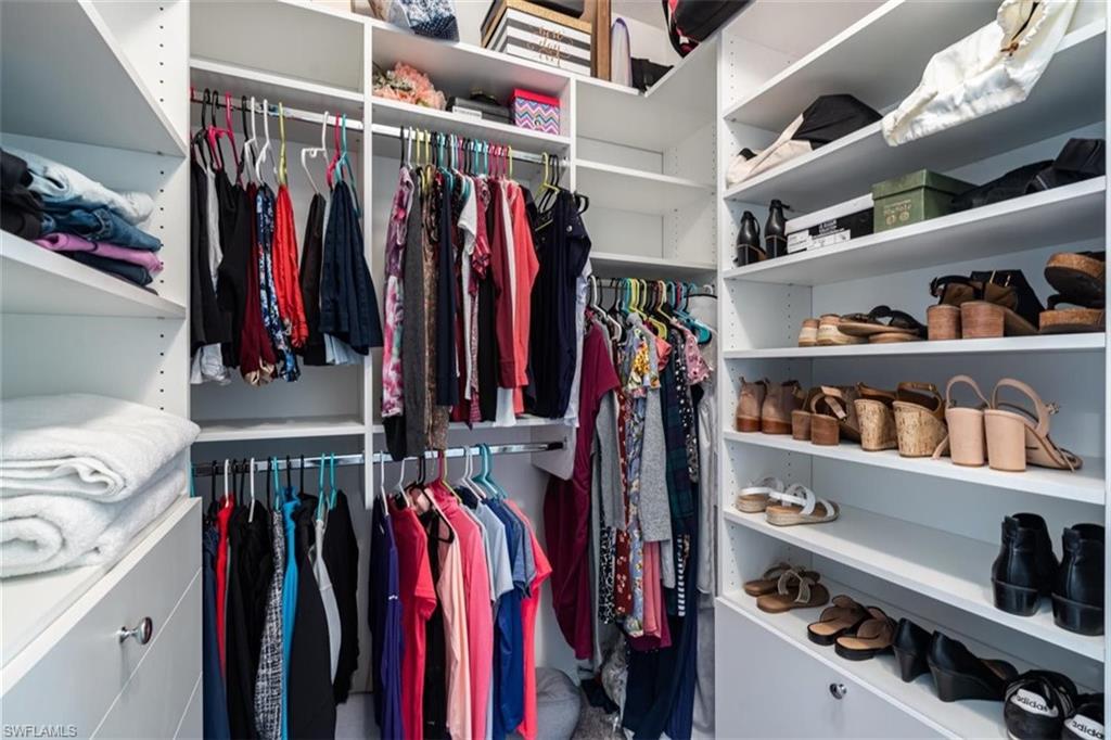 5586 Useppa Drive Ave Maria, FL 34142 - Photo 12 of 30 a view of walk in closet with clothes and shoes