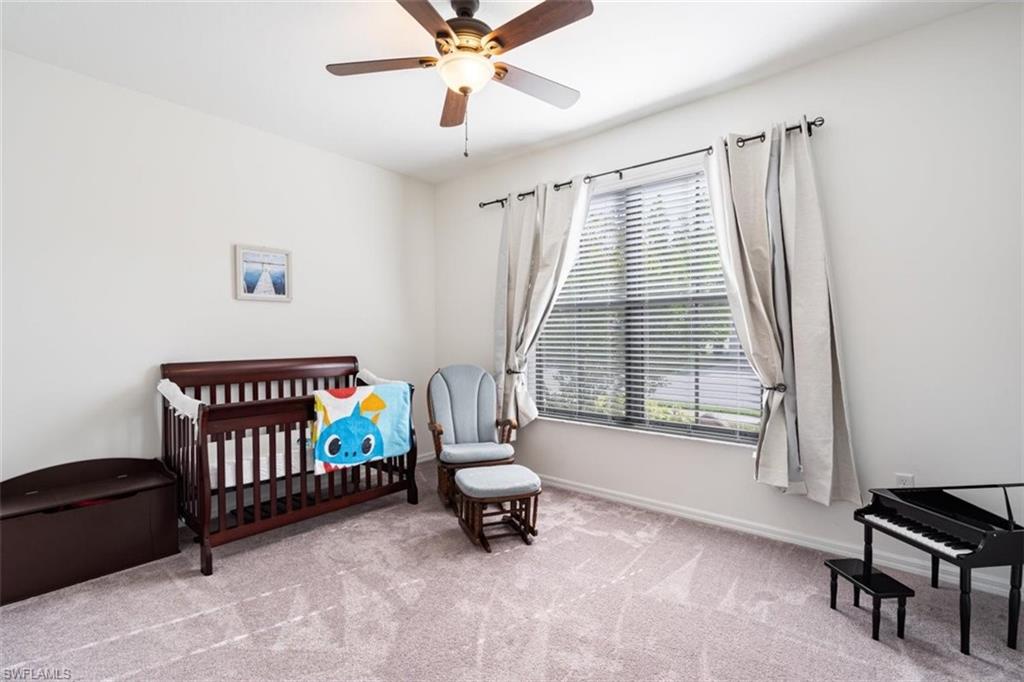 5586 Useppa Drive Ave Maria, FL 34142 - Photo 16 of 30 a bedroom with furniture and windows