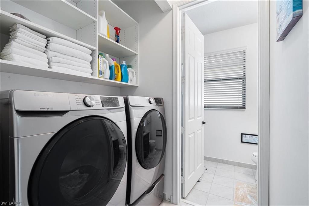 5586 Useppa Drive Ave Maria, FL 34142 - Photo 17 of 30 a utility room with dryer and washer