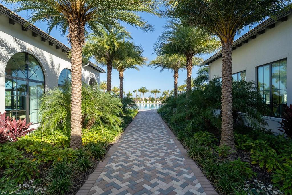 5586 Useppa Drive Ave Maria, FL 34142 - Photo 22 of 30 a view of a pathway with house on both side