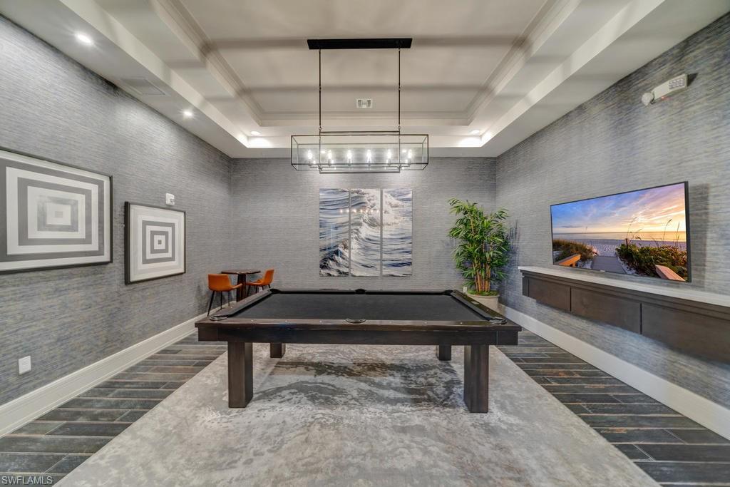 5586 Useppa Drive Ave Maria, FL 34142 - Photo 27 of 30 a room with pool table and a chandelier