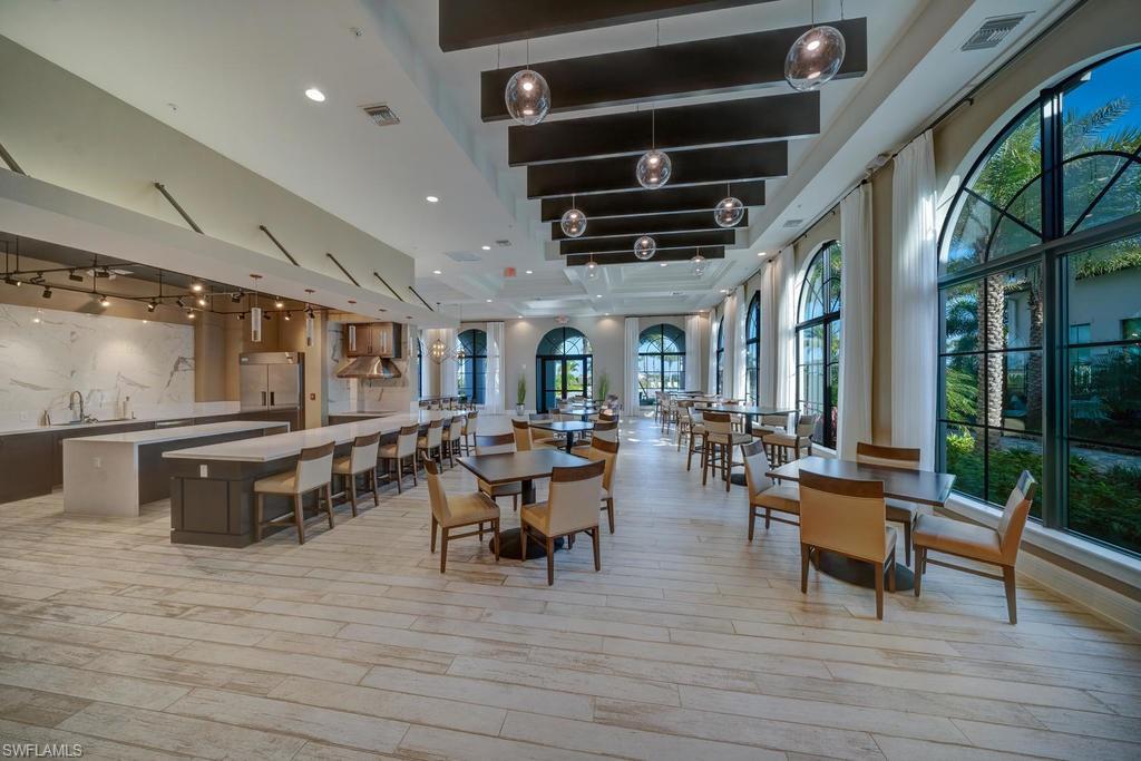 5586 Useppa Drive Ave Maria, FL 34142 - Photo 30 of 30 a living room with lots of furniture and a wooden floor