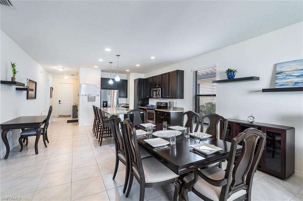 5586 Useppa Drive Ave Maria, FL 34142 - Photo 6 of 30 a view of a dining room with furniture