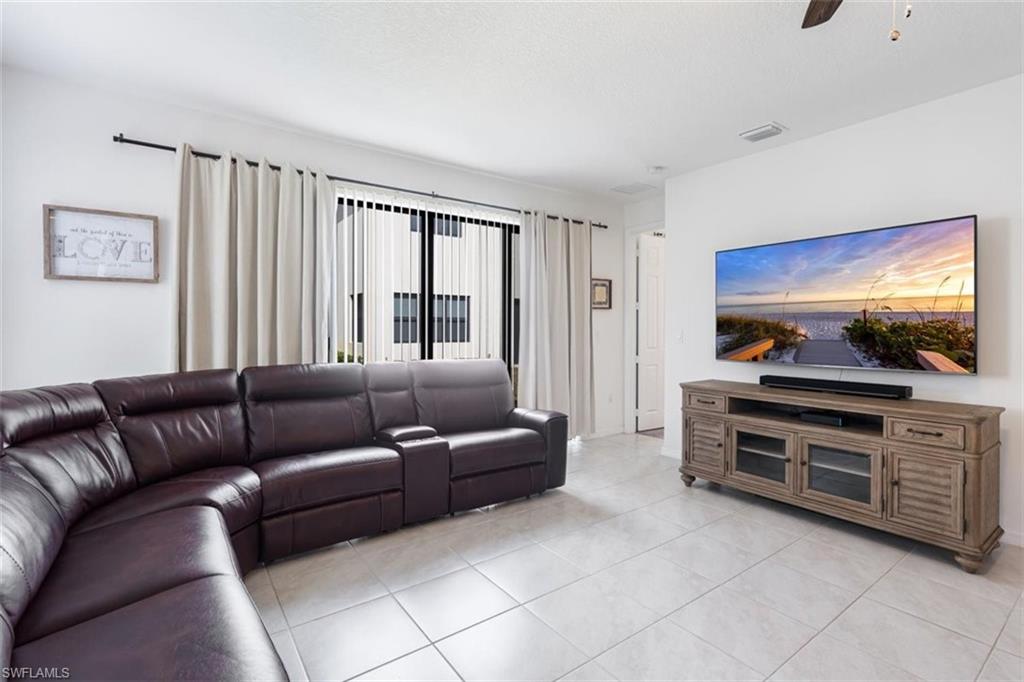 5586 Useppa Drive Ave Maria, FL 34142 - Photo 8 of 30 a living room with furniture and a flat screen tv