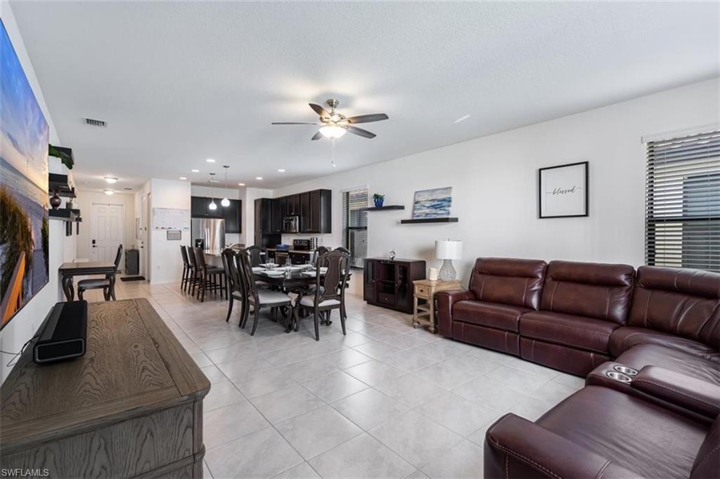 5586 Useppa Drive Ave Maria, FL 34142 - Photo 9 of 30 a view of a livingroom with furniture and a large window