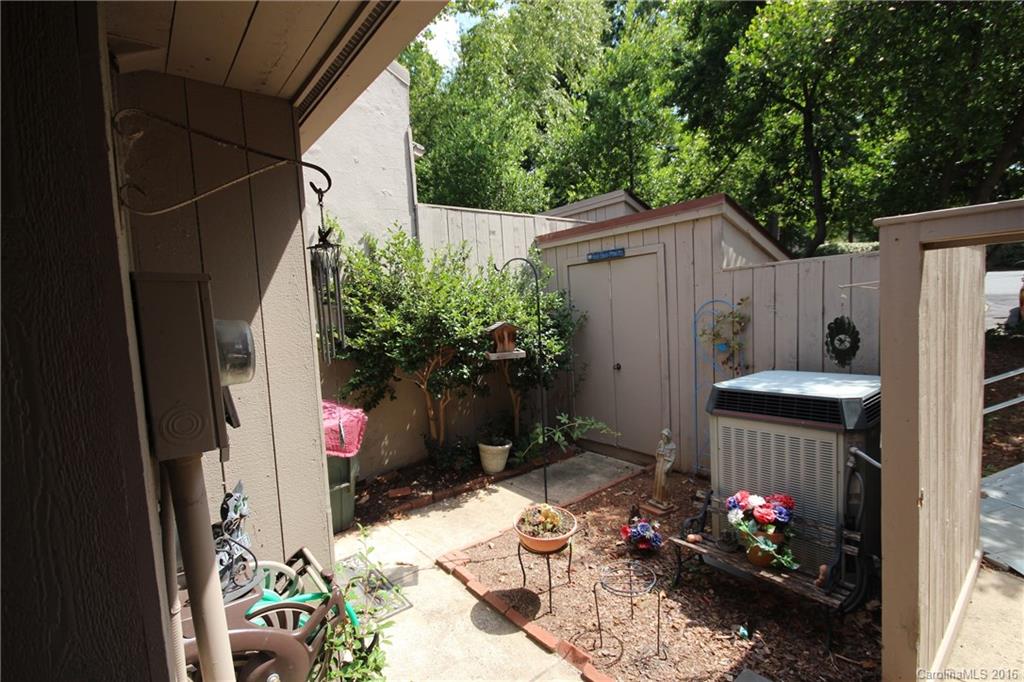 33 Old Post Road, Unit 33 Lake Wylie, SC 29710 - Photo 11 of 15 a backyard of a house with outdoor seating