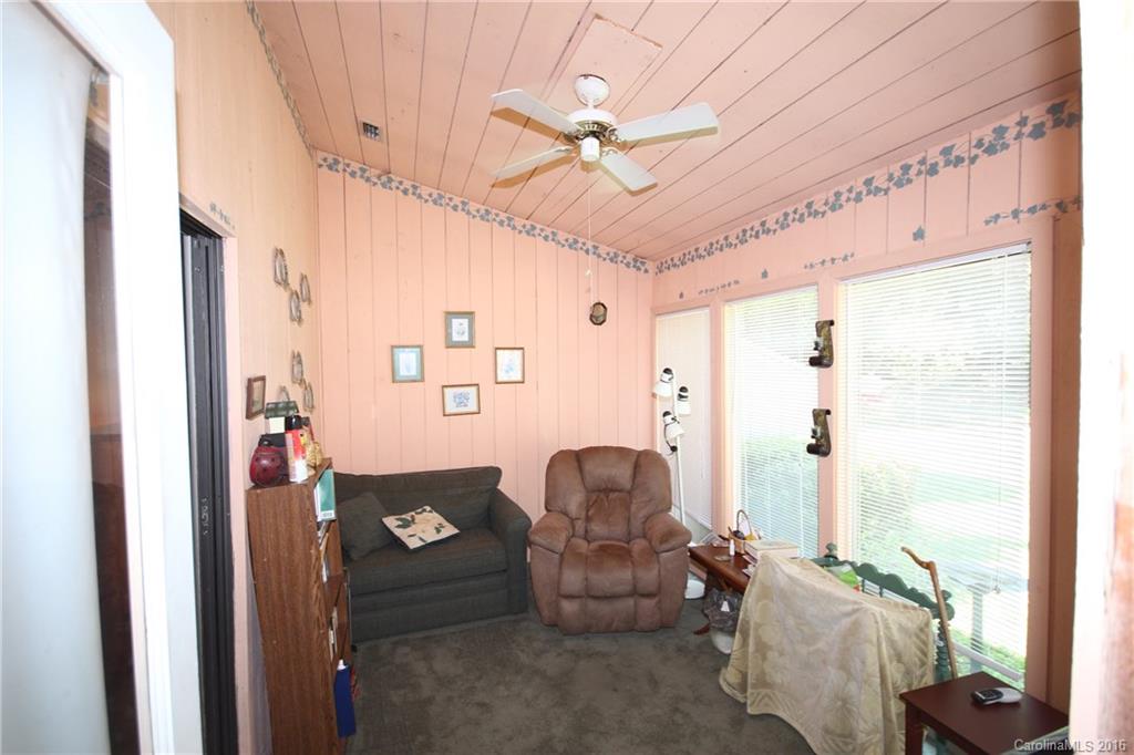 33 Old Post Road, Unit 33 Lake Wylie, SC 29710 - Photo 12 of 15 a living room with furniture and a chandelier