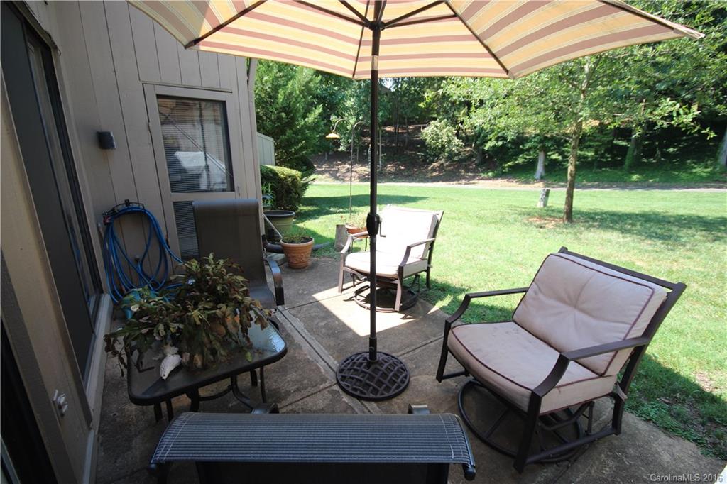 33 Old Post Road, Unit 33 Lake Wylie, SC 29710 - Photo 14 of 15 a view of a backyard with garden and patio
