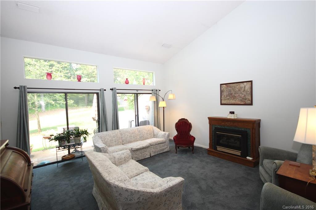 33 Old Post Road, Unit 33 Lake Wylie, SC 29710 - Photo 5 of 15 a living room with furniture large window and flat screen tv
