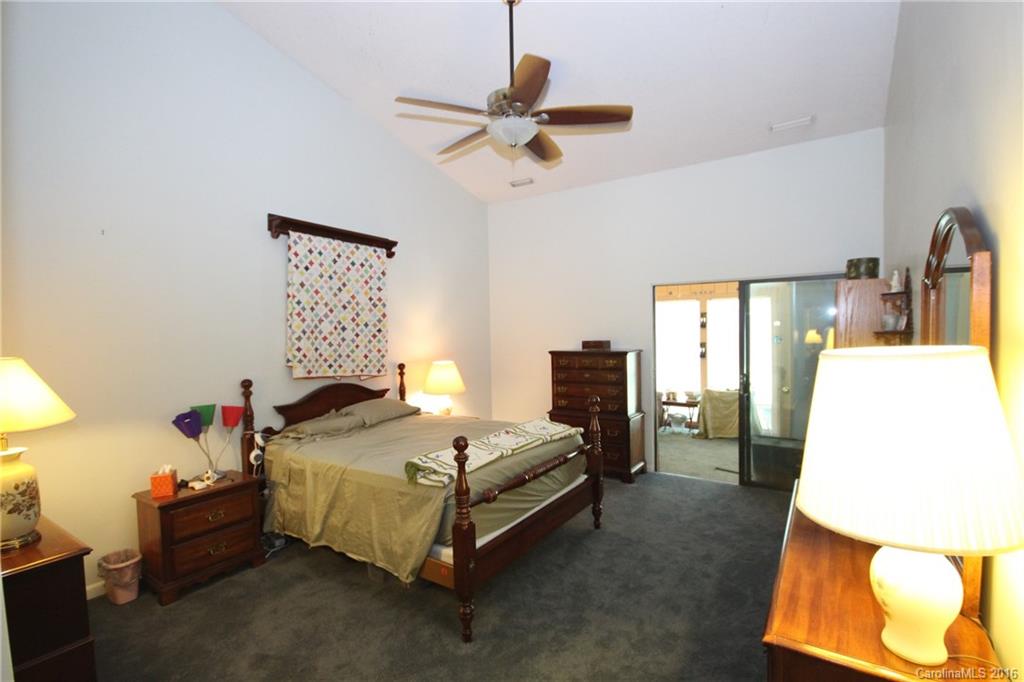 33 Old Post Road, Unit 33 Lake Wylie, SC 29710 - Photo 9 of 15 a bedroom with a bed and ceiling fan