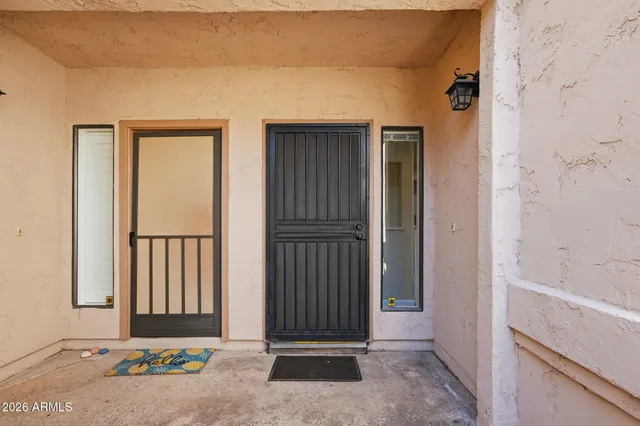 an entrance view of a wooden door