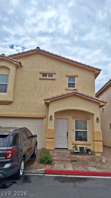 5171 Piazza Cavour Drive Las Vegas, NV 89156 - Photo 1 of 13 A welcoming front entrance showcases a classic stucco facade and attached garage.